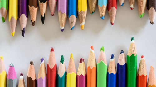 Close-up of colorful pencils on white background