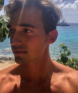 Close-up portrait of shirtless man