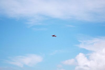 Low angle view of airplane flying in sky