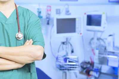 Midsection of nurse standing at hospital