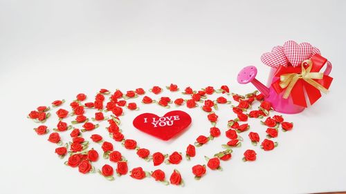 Close-up of red heart shape on white background