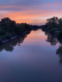 Scenic view of lake against sky during sunset