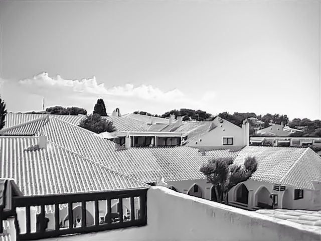 architecture, building exterior, built structure, house, roof, sky, residential structure, mountain, residential building, town, residential district, day, railing, high angle view, cloud, tree, outdoors, mountain range, no people, cloud - sky