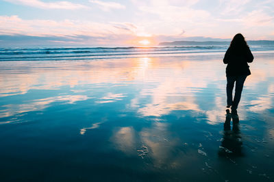 Woman standing on beach