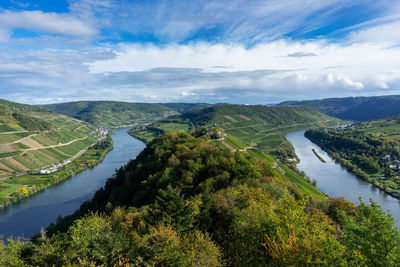 High angle view of river amidst landscape against sky