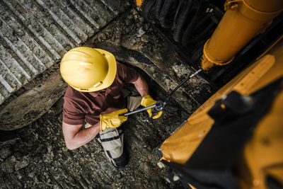 Directly above view of man working in factory