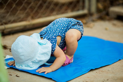 Girl bending on blanket