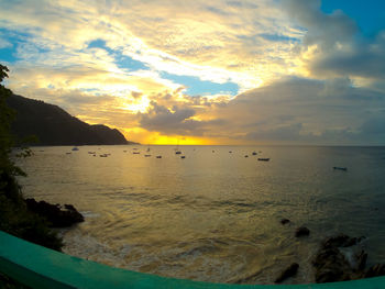 Scenic view of sea against sky at sunset