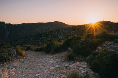Scenic view of mountains against sky during sunset