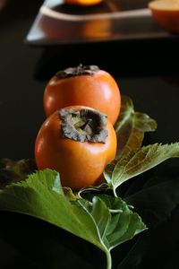 High angle view of orange fruit against black background