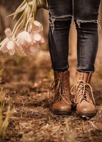 Low section of person standing in shoes