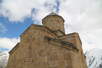 Low angle view of building against sky during winter