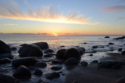 Scenic view of sea against sky during sunset