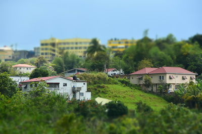 Buildings in city against clear sky