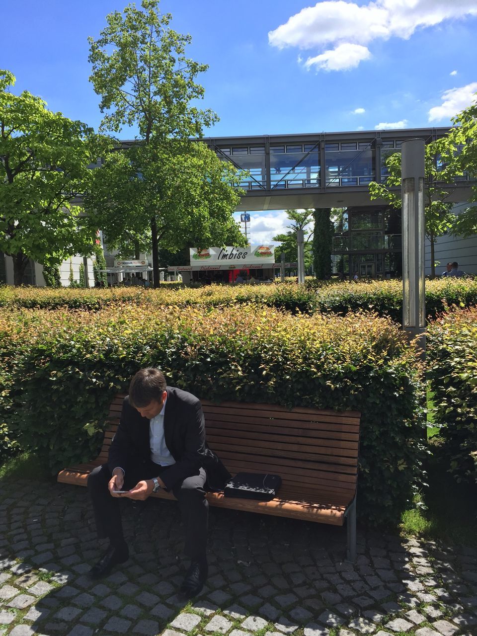 MEN SITTING IN PARK