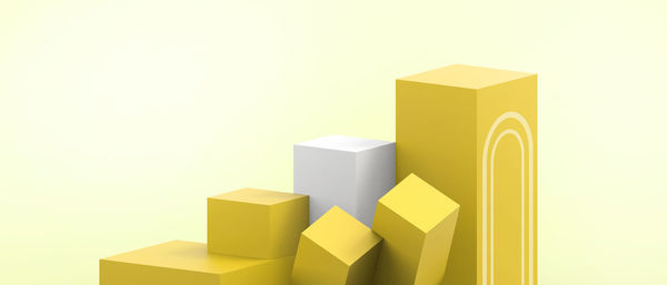 Close-up of yellow toys against white background