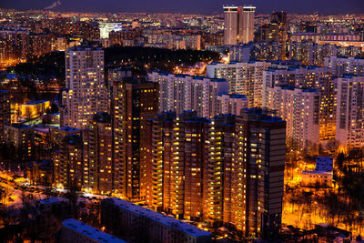 Aerial view of city lit up at night