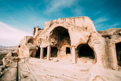 Old ruins of building against cloudy sky