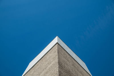 Low angle view of building against clear blue sky