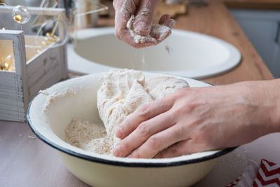 Cropped hand of person preparing food