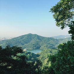 Scenic view of mountains against clear blue sky