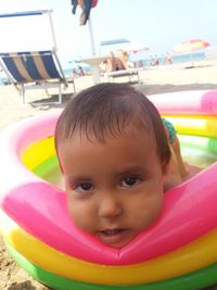 Portrait of cute baby girl in swimming pool