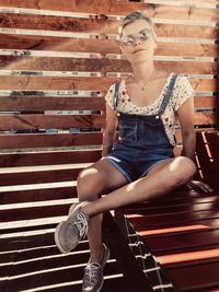 Portrait of woman sitting on bench