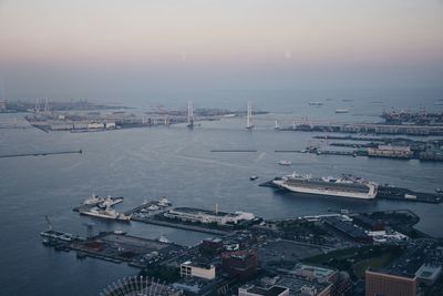 High angle view of harbor by sea against sky