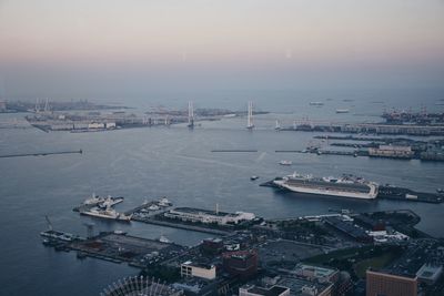 High angle view of harbor by sea against sky