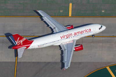 High angle view of airplane on airport runway