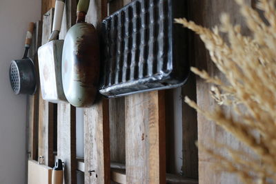 Low angle view of electric hanging on wood