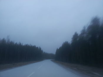 Road passing through forest