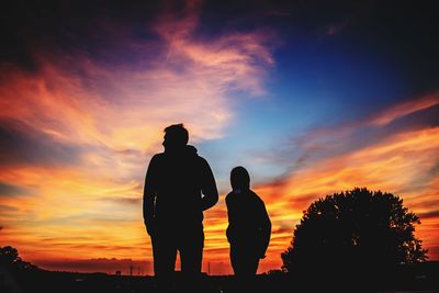 Silhouette of people at sunset