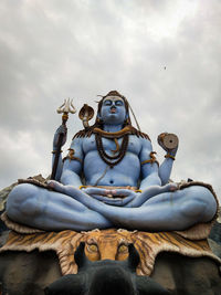 Low angle view of statue against sky