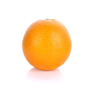 Close-up of orange apple against white background