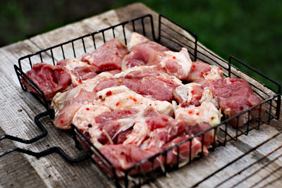 High angle view of meat on barbecue grill