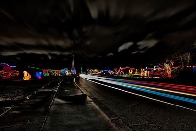 Light trails on road in city at night