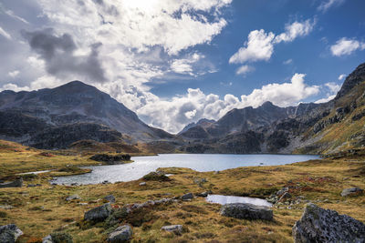 Scenic view of lake and mountains against sky