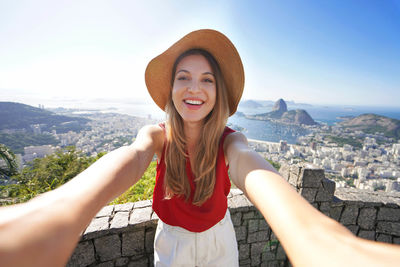 Self portrait of girl with famous guanabara bay with sugarloaf mountain in rio de janeiro, brazil