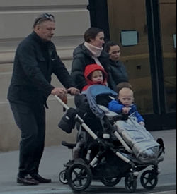 Full length of father and son on sidewalk