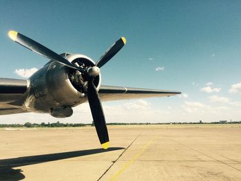 Cropped airplane against blue sky