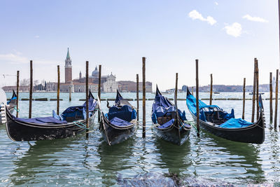 Boats moored in canal