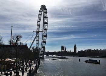 Low angle view of amusement park against sky