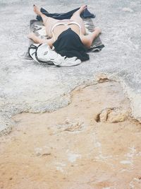 High angle view of couple sitting on beach