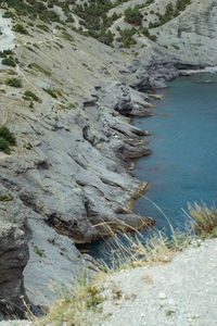 High angle view of rocks on shore