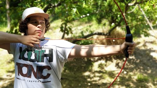 Boy holding a bow