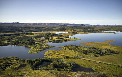 Crystal lakes surrounded by gardens and green trees