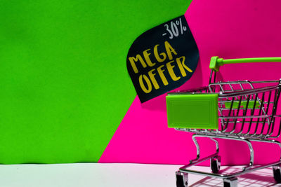 Close-up of text on pink store