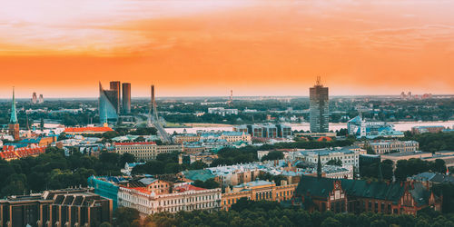 Townscape against sky during sunset