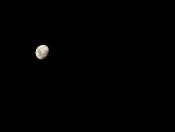 Scenic view of moon against clear sky at night